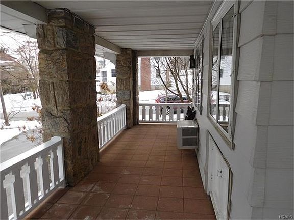 Charming covered porch accessible from Living Room or Kitchen