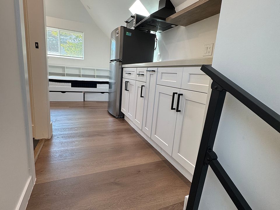 Stairwell into unit, kitchenette