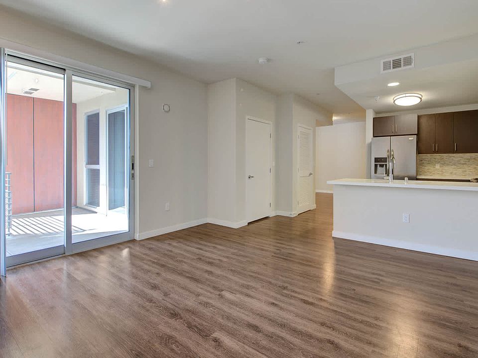 Living Room with Balcony and Hard Surface Flooring