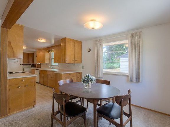 Dining room with two corner windows is open to kitchen and living room. This home is clean and polished and ready for you to simply move in and enjoy!