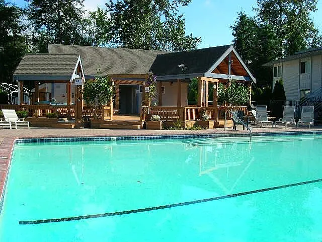 Key-controlled Pool area with Hot-tub, change rooms, and BBQ picnic area.