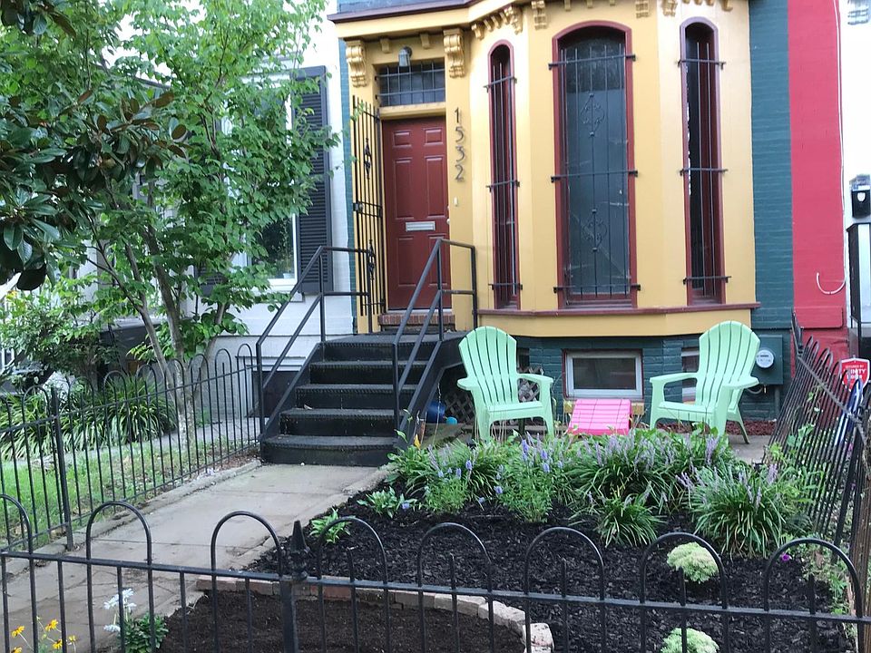 Front of house with maintained lawn.