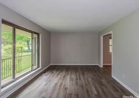 front room with oversized window overlooking front yard