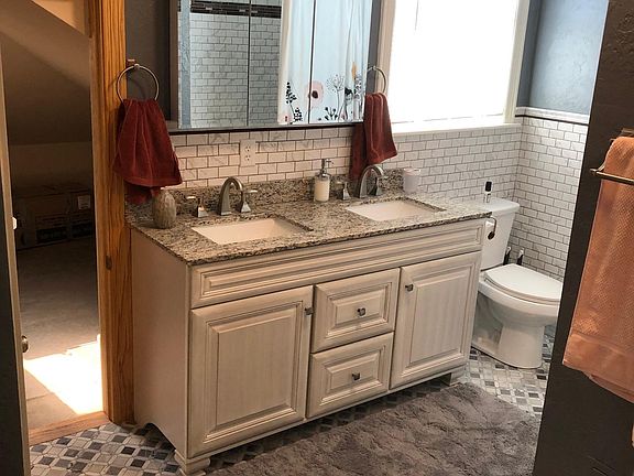 Spacious bathroom with double sink vanity.