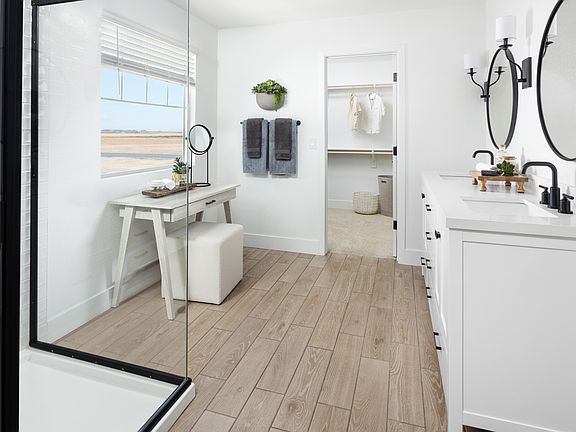 Primary bath with dual sinks and chrome fixtures throughout