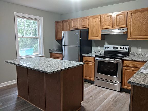 Newly renovated kitchen! New granite countertops, stainless steel appliances, and new flooring.
