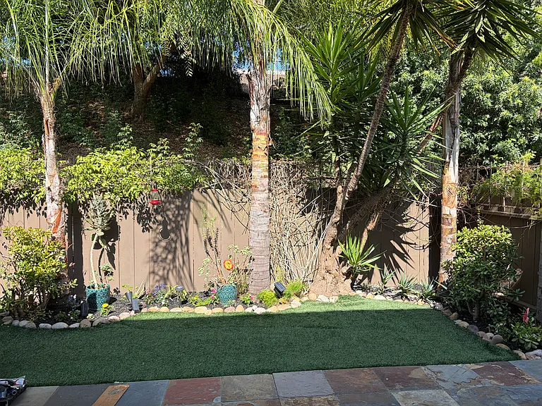 Another view of the amazing private back yard with private locking gate that leads to side yard.