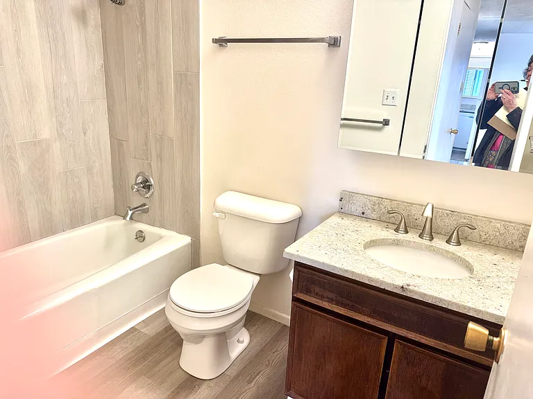Newly remodeled full bath with granite counters, new faucets lighting etc.