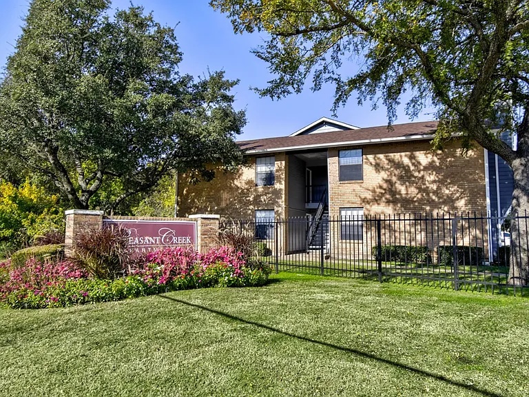 Beautifully landscaped entrance showcasing our pet-friendly, well-kept community.