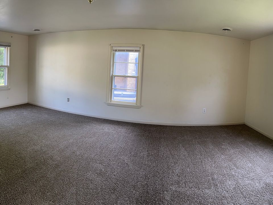 Living room is really large, has beautiful picture windows and a brand new carpet!