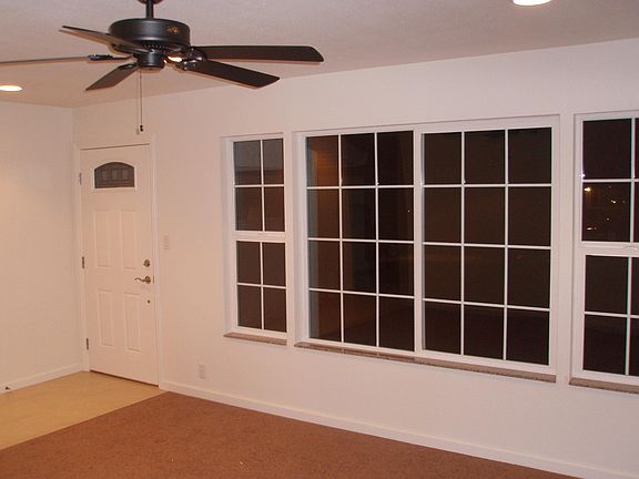 Front door and family room with large windows