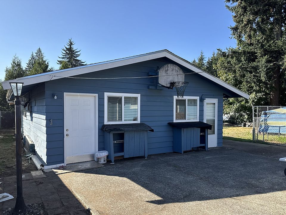 Front of triplex; entry to unit #2 on left