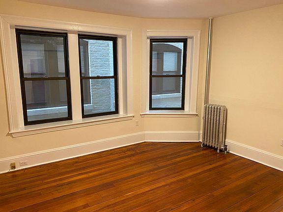 MAIN LIVING ROOM Large windows and hardwood floors!