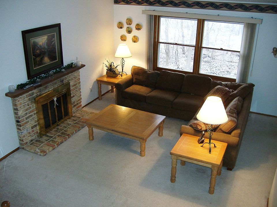 Main floor living room with wood burning fire place