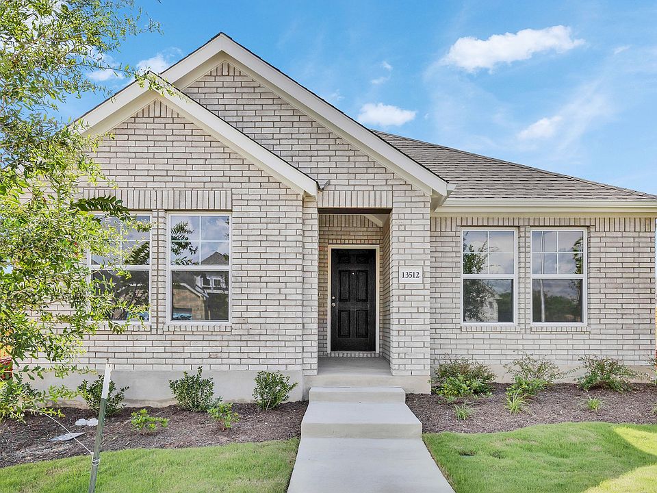 Discover refined brick architecture and gable roof elegance in this Creeks Crossing luxury home.