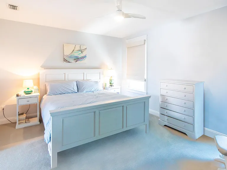 Large master bedroom with a king sized bed. The master bedroom has two closets.