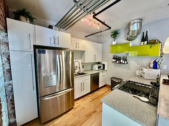 Kitchen with stainless steel appliances and new gas stove/oven