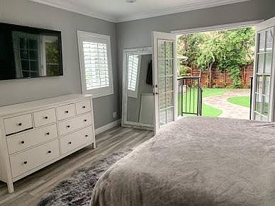Master Bedroom with french door leads to backyard