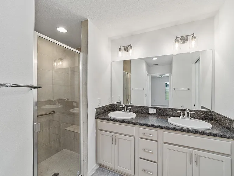 Dual-sink master bath with glass shower_pure elegance.