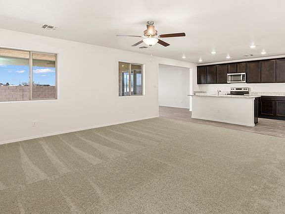 Open layout with a spacious family room and upgraded kitchen.