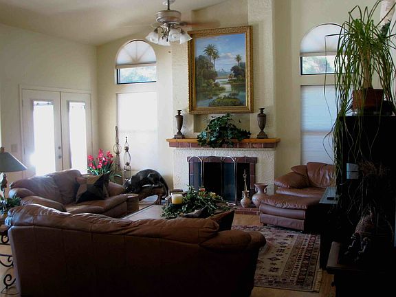 Great room with fireplace, French doors to back patio and po