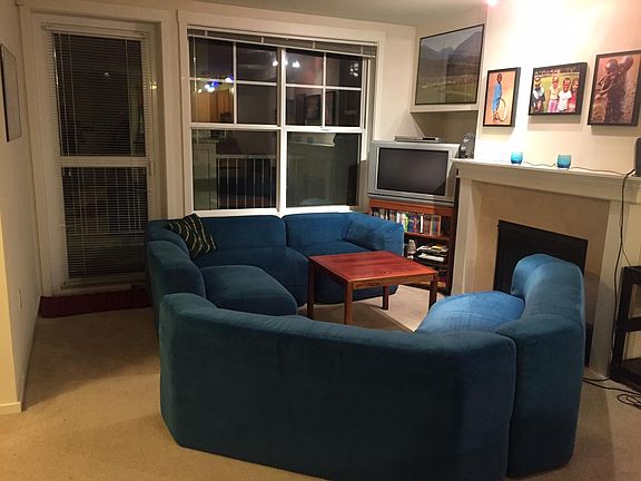 Living room with door to private balcony