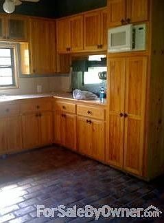 Kitchen Cabinets : Cypress Cabinets and Brick Floors