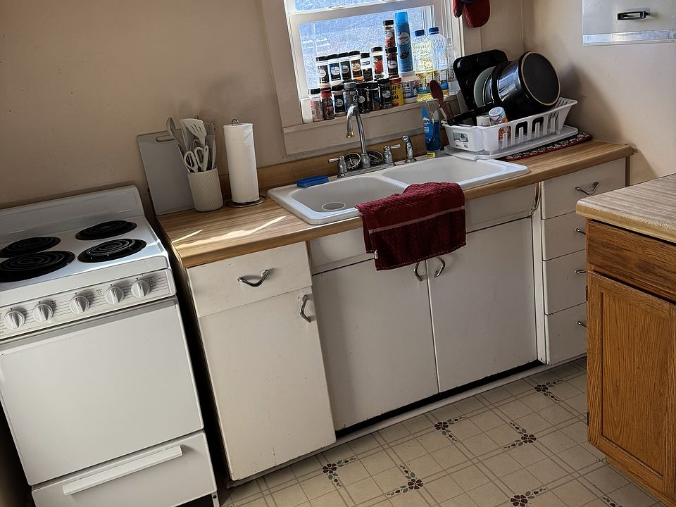 Kitchen facing back yard. Stove included.