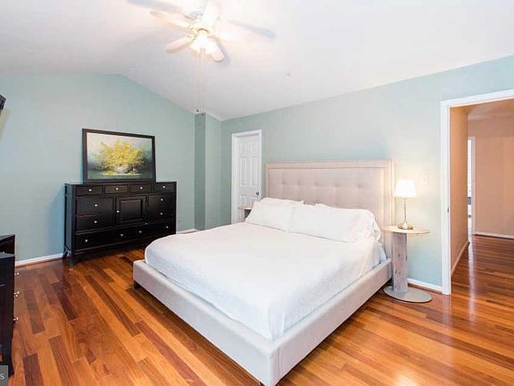 Primary bedroom with en suite master bath and cathedral ceilings