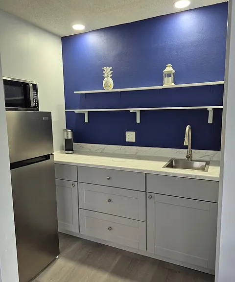 Kitchenette with sink, private fridge, microwave and coffee maker