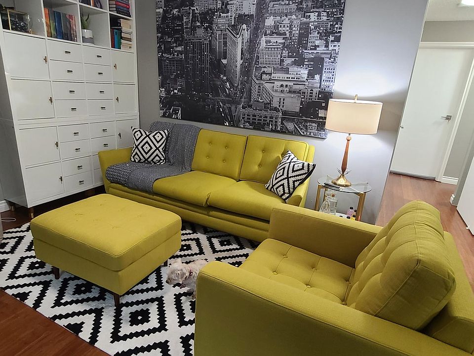 Spacious living room with ceiling fan