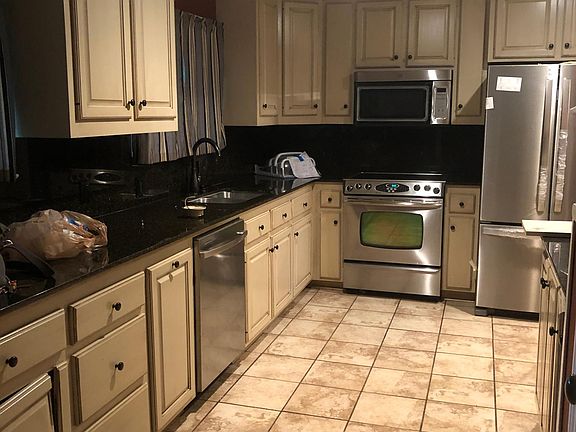 Kitchen view from left of the entrance to house.
