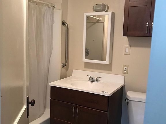 En suite with tub/shower combo, recently updated vanity set.