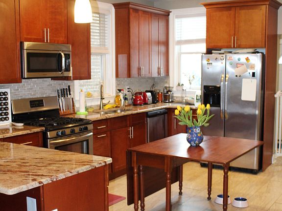 Updated open kitchen with granite countertops and stainless steel appliances