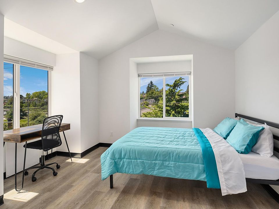 Furnished bedroom with views and vaulted ceilings