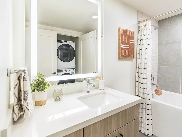 Enjoy built-in storage and shelving solutions alongside the convenience of an in-home, full-size washer and dryer.