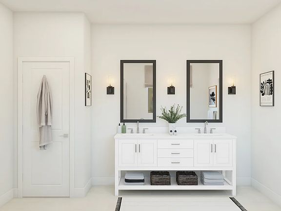 Primary bath featuring freestanding vanity with dual sinks