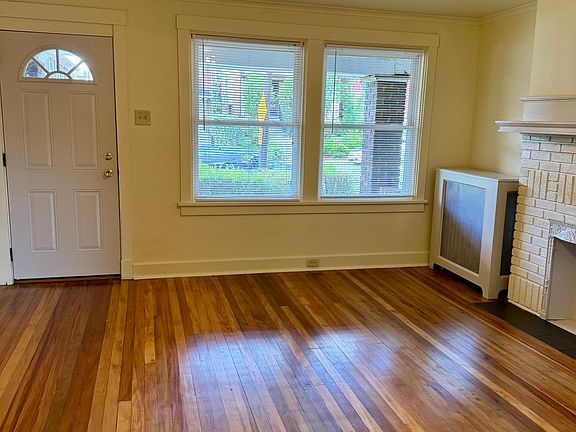 Living room to front door. Home has central air but also plenty of ceiling fans
