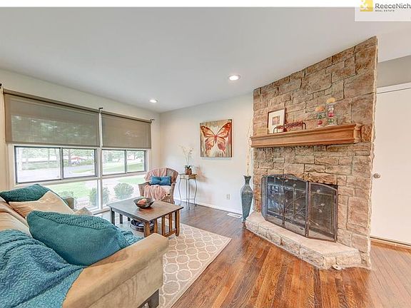 Cozy Fireplace and Roman Shades