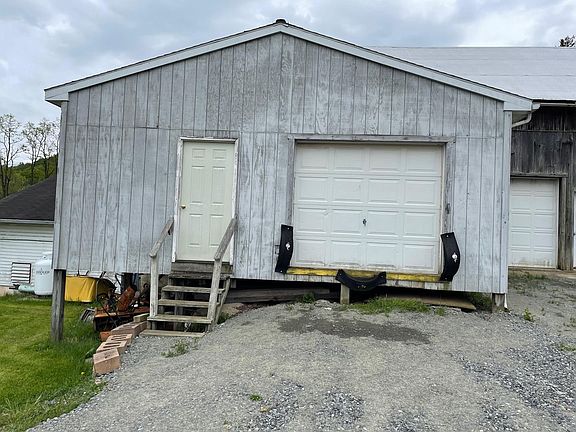 Three type of entrances, steps to the left, loading dock height in center, or ground level garage door and an entrance door to the right of that.