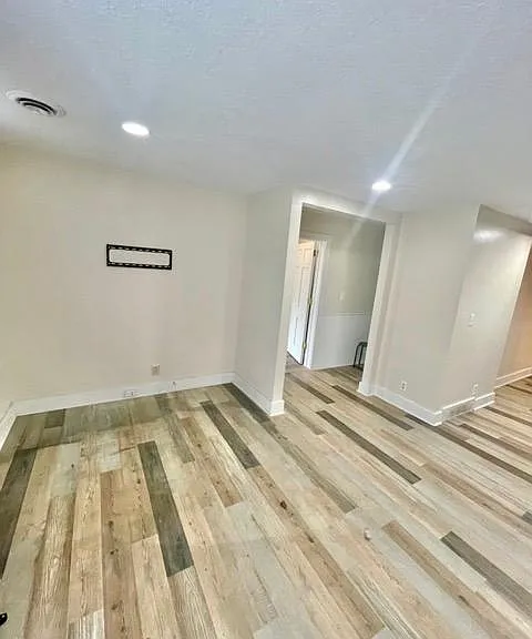 Living room. Hallway connects to bedroom, and bathroom.