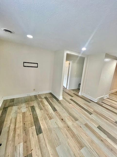 Living room. Hallway connects to bedroom, and bathroom.