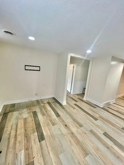 Living room. Hallway connects to bedroom, and bathroom.