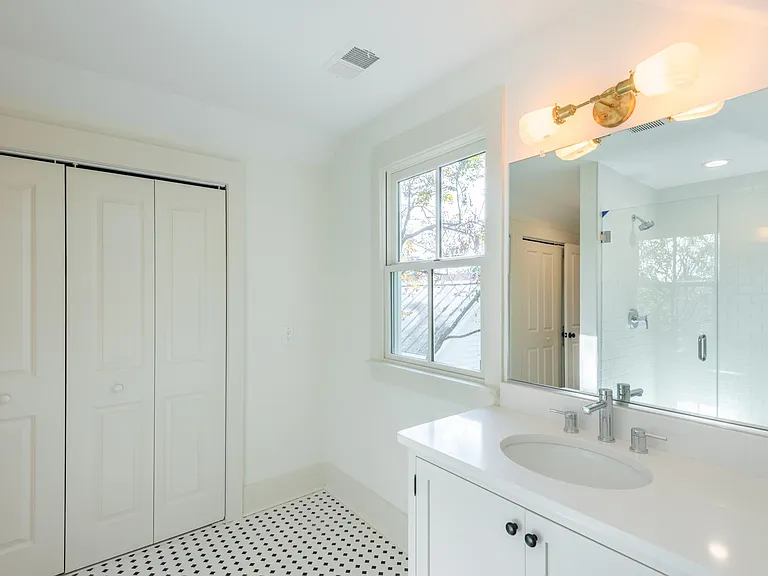 The master closet extends the entire length of the master bathroom!