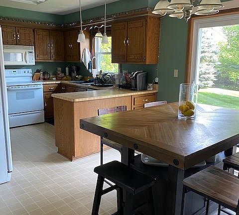 Kitchen with Dinette and Patio Door to Private Patio