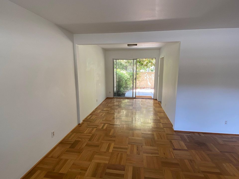 View of dining area and patio from living room