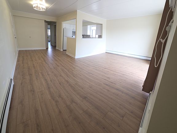 Livingroom/Dining Room as you enter the unit with new vinyl flooring