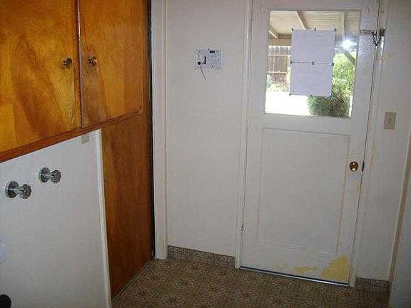 Laundry and door to pool area