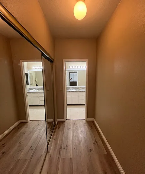 MASTER BEDROOM MIRROR CLOSET DOORS going to bathroom