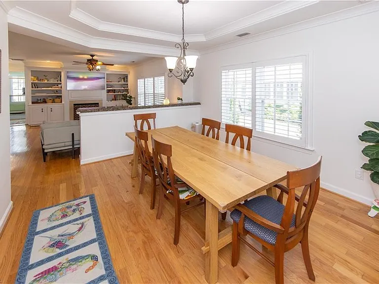 Hard teak wood dining room table for up to 8 people. Additional 4 person card table and chairs in closet for large family dinners / hoildays when needed.